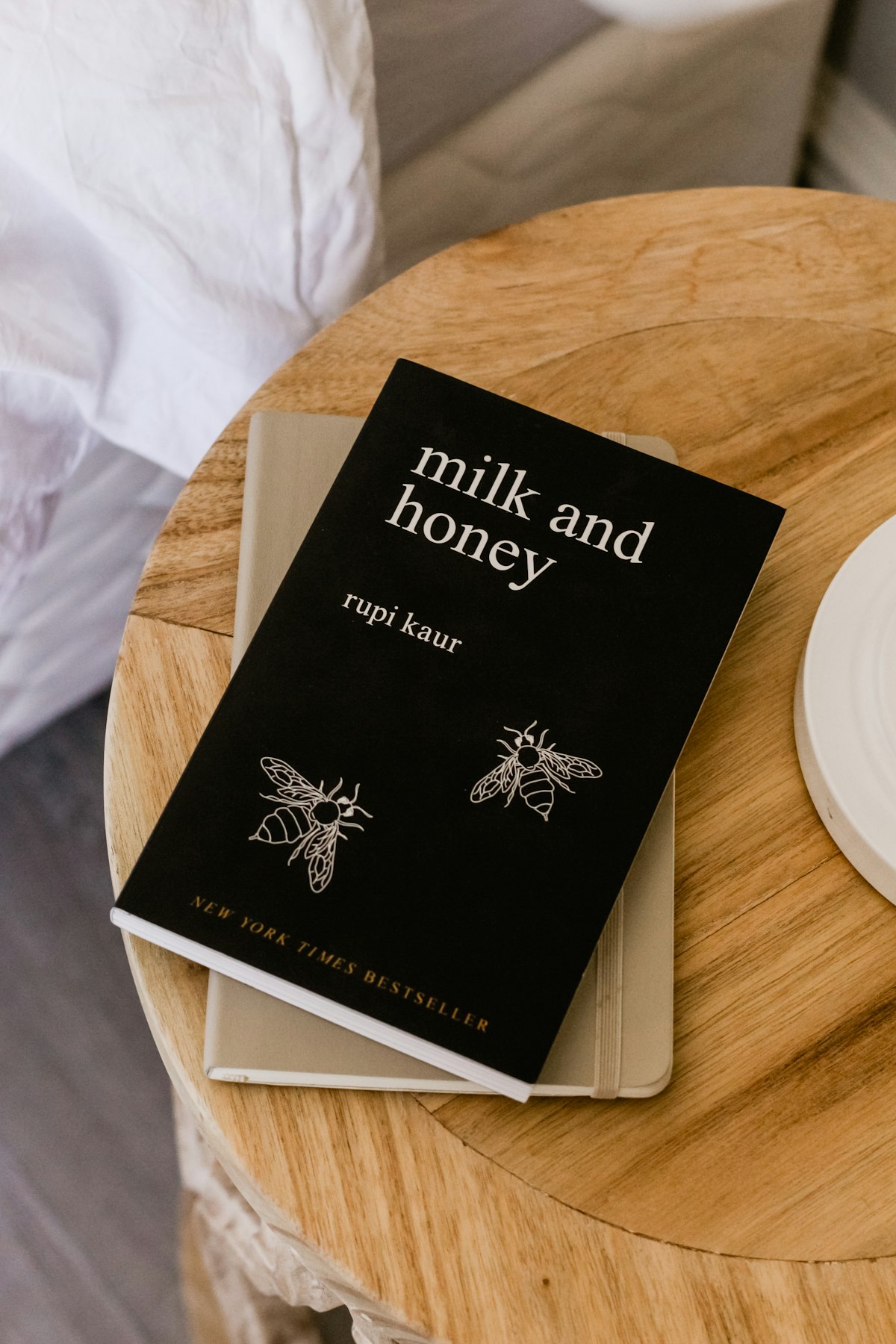 A minimal book cover resting on a dark surface